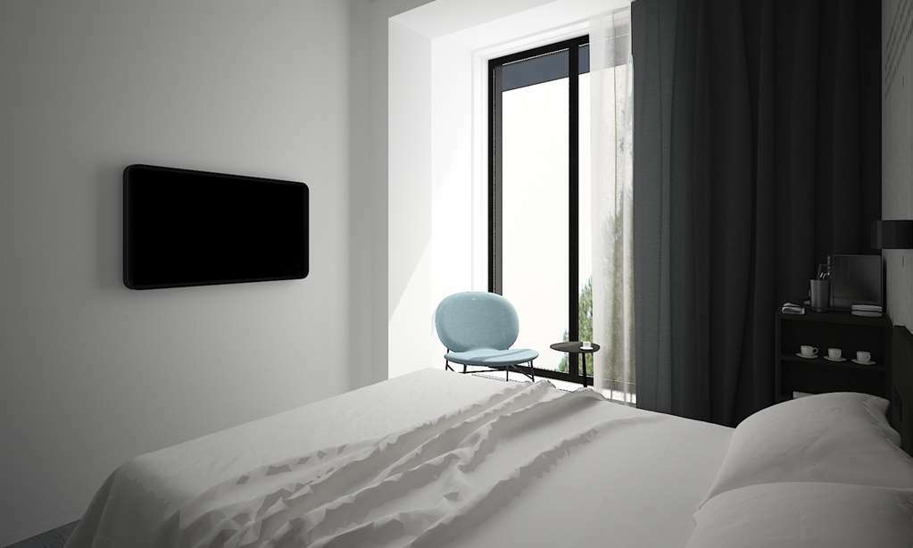 Hotel Golden Tulip Design Tiflis Habitación foto